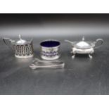 Two silver Mustard Pots, a pierced circular Salt, Salt Spoon and Sugar Claws