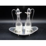 A pair of Edward VII silver-mounted cut-glass Vinegar Bottles on pierced oval stand having gadroon