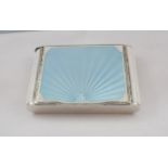 An Art Deco silver and enamel Compact the lid with duck egg blue fan design on white ground,