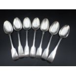 A matched Set of seven early 19th Century Irish silver Teaspoons, fiddle pattern, engraved initial