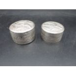 Two Cambodian silver circular Boxes embossed dragons, etc, approx, 2½in