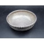An Eastern woven silver Basket with simulated bamboo rim, 4¾in