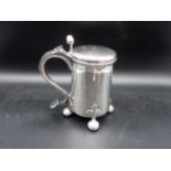 A George III silver Tankard in the Scandinavian style with hinged lid having double bud thumb piece,
