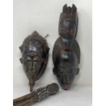 A Congo Baule Face Mask 14inL, a Ugandan double Face Mask 16 1/2in L and a Shrine Broom from Gabon