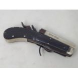 A Victorian Unwin & Rodgers self protector rim fire Pistol with two knives to underside (one tip
