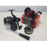 A boxed Abu Garcia Ambassaduer 6000 Baitcasting Reel, a "Grey's" G1 Fly Reel, a Daiwa GS 2050