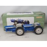 A boxed Universal Hobbies DOE-130 Tractor