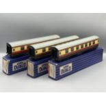 Seven Hornby Dublo 3-rail Coaches comprising pair of D13, D14 Brake with over sticker box, pair D12,