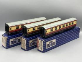 Seven Hornby Dublo 3-rail Coaches comprising pair of D13, D14 Brake with over sticker box, pair D12,