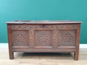 A 17th Century oak West Country Coffer with sunken three panel lid above arcaded leafage shallow