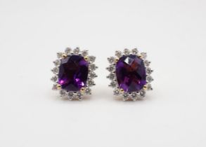 A pair of Amethyst and Diamond Cluster Earrings each corner claw-set rectangular mixed-cut