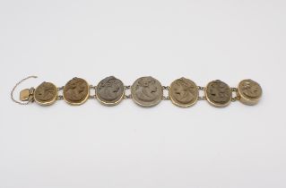 A Lava Cameo Bracelet the seven graduated links each carved bust in profile in gilt metal