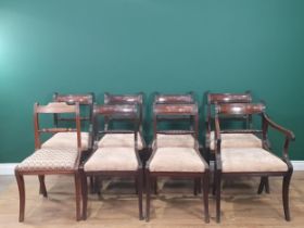 A set of Eight Regency mahogany Dining Chairs, with reeded frames on sabre legs, drop in seats Viz 2