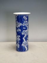A Chinese blue and white Vase of cylindrical form with flared rim and decorated flowering prunus