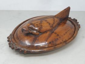 A carved treen Hen Tureen, the lid handle in the form of a hen with pair of pierced scrolled handles