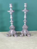 A pair of pewter Candlesticks with wide drip pans, knopped stems and tripod bases, 14in H