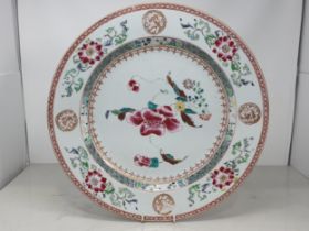 A 19th Century Chinese Charger with floral design within green border surrounded by a frieze of