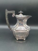 A George V silver Hot Water Jug of panelled form on ball feet, Sheffield 1927, 650gms all in