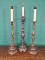 A pair of walnut Table Lamps with baluster turned stems on circular bases, fitted electricity, and a