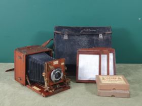 A Houghton's Sanderson Tropical Model Bellows Plate Camera with brass mounts, including mahogany