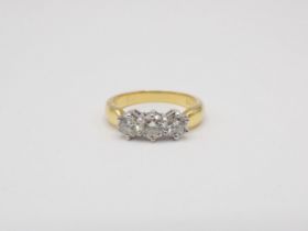 A Diamond three stone Ring claw-set brilliant-cut stones, total diamond weight 1.00ct, marked