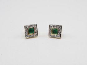 A pair of Emerald and Diamond square Cluster Earrings each rubover-set step-cut emerald within a