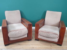 A pair of Art Deco walnut Armchairs with upholstered backs and seats with rectangular arms and
