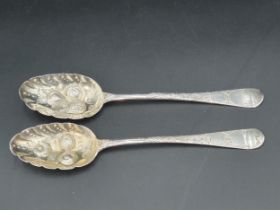 Two Georgian silver Berry Spoons Hanoverian pattern with fruit embossed bowls, London 1806 & 1824