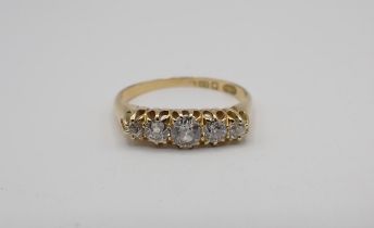 A Diamond five stone Ring claw-set graduated old-cut stones in 18ct gold, ring size Q, approx 3.