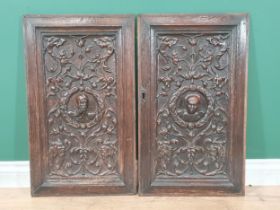 A pair of Flemish 16th Century carved oak Panels with relief busts of a soldier and lady within