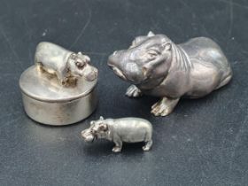 Two modern miniature silver Hippos and a small circular Pill Box with hippo surmount, London 1997,