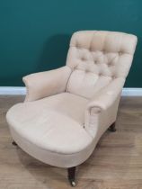 A Howard and Sons deep seated button back upholstered Armchair, with square tapered front supports