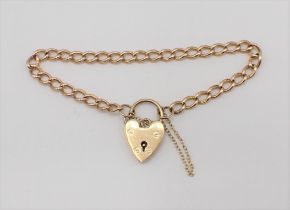 A 15ct gold fine curb link Bracelet on 9ct gold padlock fastener, approx 12.20gms all in