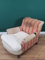 A Howard and Sons deep seated Armchair with some red and cream striped upholstery, with scroll and