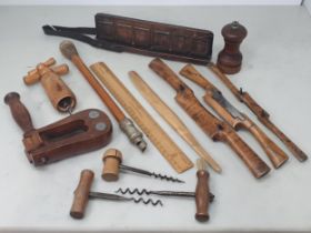 A collection of treen and related items including four Corkscrews, a vintage Football Rattle bearing