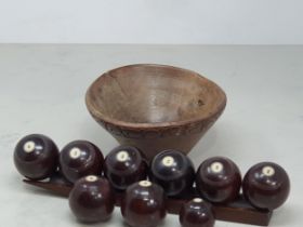 A 19th Century set of Lignum Vitae Carpet Bowls of small size, eight bowls numbered 1-4 (two of each