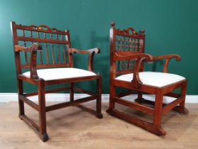 A near pair of Georgian yew wood Northumberland Drunkard's Chairs with two-tier turned spindle back,