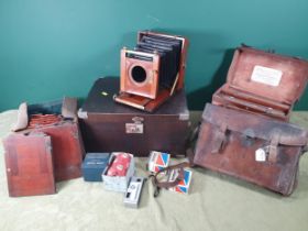 A mahogany and brass mounted Plate Camera, and three cases of plate holders