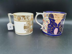 A Crown Derby Mug with Imari colours, floral and leafage scroll designs on a blue ground, 5in H