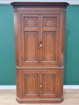 A George III scumbled pine double Corner Cupboard with dentil frieze above two pairs of panelled