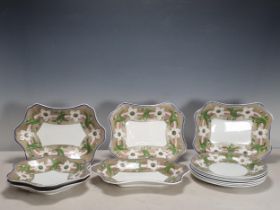 An early 19th Century Pearlware part Dessert Service with borders of flowers and leaves on a grey