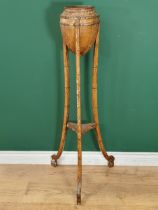 A 19th Century painted faux bamboo two tier Plant Stand the top in the form of an Acorn, raised on