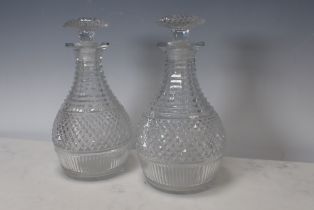 A pair of Georgian cut glass Decanters and Stoppers with diamond cut designs, 9½in H