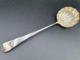 A George III silver Ladle old English pattern with scallop Bowl, engraved crest, circa 1770,
