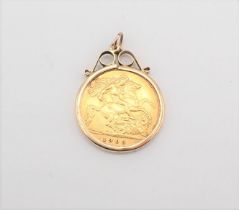 An Edward VII half Sovereign 1909 in 9ct gold pendant mount, approx 4.96gms all in