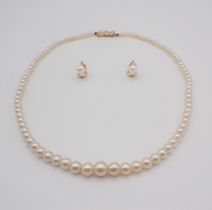 A single row of graduated Cultured Pearls on 9ct gold bow shaped clasp together with a pair of