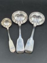 A pair of Victorian silver Sauce Ladles fiddle pattern, London 1859, and an Irish Toddy Ladle fiddle