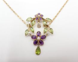 A Diamond, Peridot, Amethyst and Seed Pearl Necklace formed as flowers and leaves on oval frame