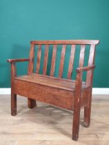 An 18th Century Welsh elm and oak child's Bench with lath back and plank seat raised on squared