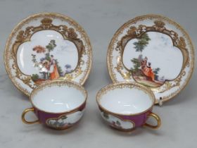 A near pair of Dresden Cabinet Cups and Saucers, the cups with scenes of figures in landscapes on